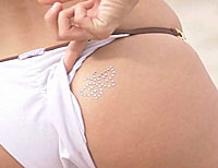 Butt cheek with crystal butterfly from the Tajazzle infomercial.