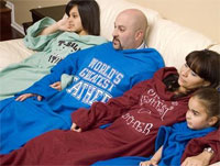 A family draped in Custom Snuggies